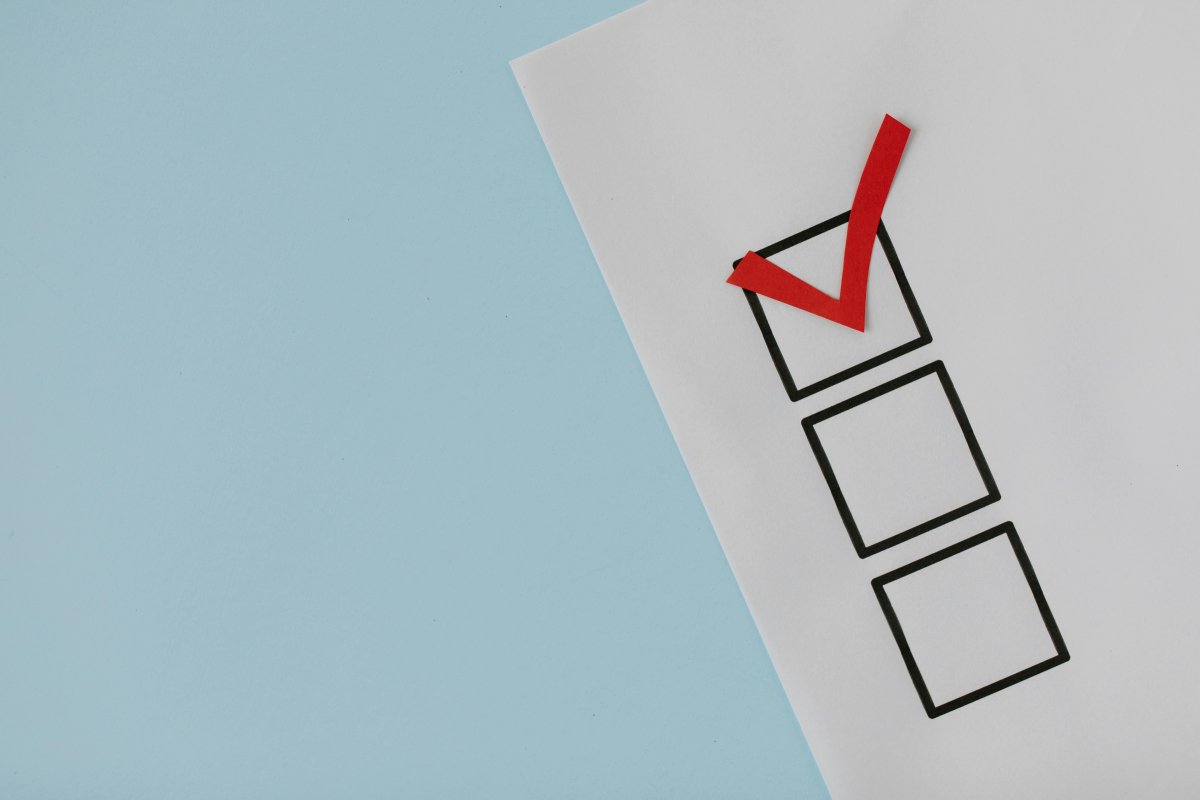 A form with three boxes with the top box checked with a red check mark